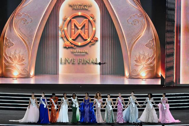Top 12 participants stand on the stage during the grand finale of the 75th Anniversary Miss World 2026 pageant at the 2 April Square in Nha Trang , Khanh Hoa Province, on September 5, 2026. (Photo by Nhac NGUYEN / AFP)