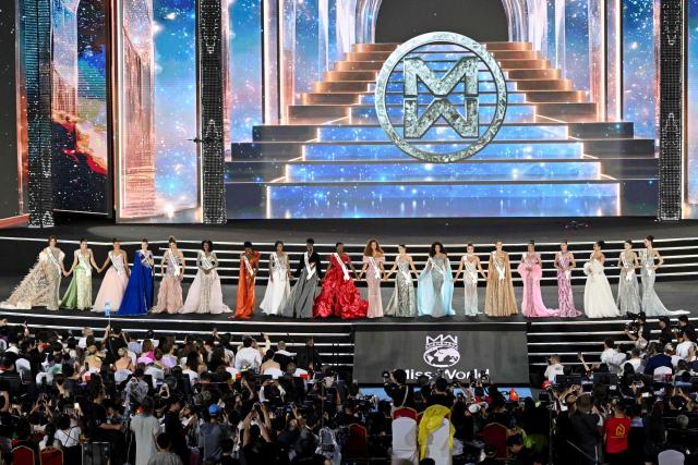 Top 20 participants stand on the stage during the grand finale of the 75th Anniversary Miss World 2026 pageant at the 2 April Square in Nha Trang , Khanh Hoa Province, on September 5, 2026. (Photo by Nhac NGUYEN / AFP)
