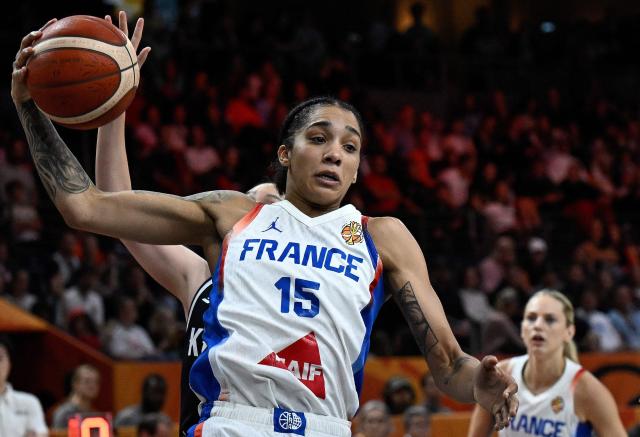 France's forward #15 Gabby Williams (L) jumps to shoot during the 2026 FIBA Women's Basketball World Cup Group B match between France and South Korea at the Berlin Arena in Berlin on September 5, 2026. (Photo by Tobias SCHWARZ / AFP) / ALTERNATIVE CROP