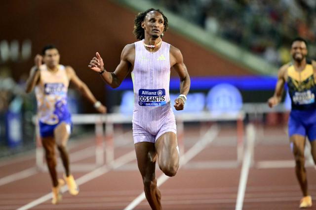 Brazil's Alison Dos Santos (C) crosses the line to win the men's 400m Hurdles final during the World Athletics Diamond League athletics meeting at the King Baudouin Stadium in Brussels, on September 5, 2026. (Photo by NICOLAS TUCAT / AFP)
