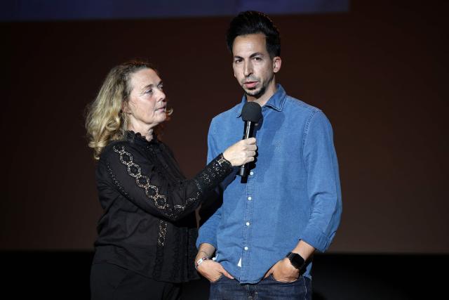 AFP Spanish photographer Luis Tato (R) speaks next to Delphine Lelu (L), co-founder of the Visa festival, after receiving the Visa d'Or News prize during the 38th edition of the Visa pour l'image press photography festival in Perpignan, southern France, on September 5, 2025. Tato won the Visa d'Or News prize for news photography for his coverage of the Generation Z protests in Madagascar. His work on the story had already been recognised at the World Press Photo Awards in April. Accepting the award, 37-year-old Tato paid tribute to the founder of the festival Jean-Francois Leroy, who died on Monday. (Photo by Valentine CHAPUIS / AFP)
