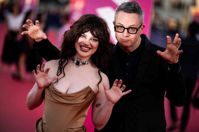 US actress Sophie Thatcher (L) and danish film director Nicolas Winding Refn (R) pose in front of photographers on the red carpet during the 52nd edition of the Deauville American film festival, in Deauville, northwestern France on September 5, 2026. (Photo by Guillaume SALIGOT / AFP)