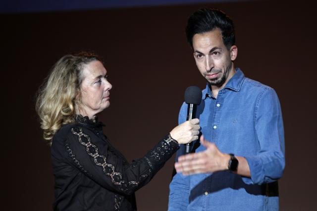 AFP Spanish photographer Luis Tato (R) speaks next to Delphine Lelu (L), co-founder of the Visa festival, after receiving the Visa d'Or News prize during the 38th edition of the Visa pour l'image press photography festival in Perpignan, southern France, on September 5, 2025. Tato won the Visa d'Or News prize for news photography for his coverage of the Generation Z protests in Madagascar. His work on the story had already been recognised at the World Press Photo Awards in April. Accepting the award, 37-year-old Tato paid tribute to the founder of the festival Jean-Francois Leroy, who died on Monday. (Photo by Valentine CHAPUIS / AFP)