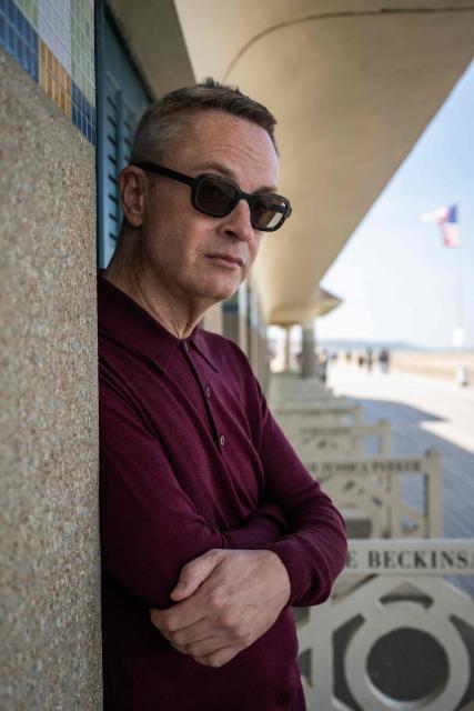 Danish film director Nicolas Winding Refn poses in front of beach cabins during a photo session during the 52nd edition of the Deauville American film festival, in Deauville, northwestern France on September 5, 2026. (Photo by Guillaume SALIGOT / AFP)