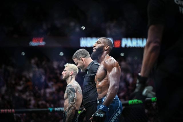 French Salahdine Parnasse (R) and New Zealand Dan Hooker wait for the judges decision during the lightweight division of their mixed martial arts (MMA) at the 5th edition of the Ultimate Fighting Championship (UFC) at the Bercy Accor Arena, in Paris, on September 5, 2026. (Photo by LOU BENOIST / AFP)