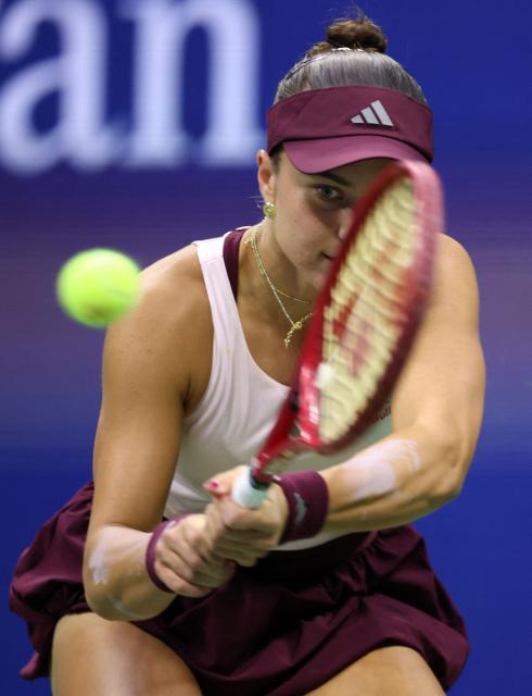 USA's Iva Jovic hits a return to Philippines' Alexandra Eala during their women's singles third round tennis match on day seven of the US Open tennis tournament at the USTA Billie Jean King National Tennis Center in New York City on September 5, 2026. (Photo by Leonardo MUNOZ / AFP)