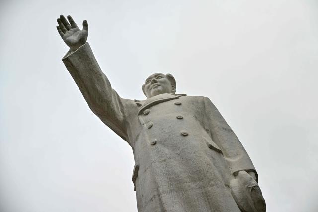 This picture taken on August 19, 2026 shows the late Communist leader Mao Zedong's statue in Shijiazhuang, in northern China's Hebei province. In the ruling Communist Party's telling, Mao remains the revolutionary hero -- his face on banknotes, his portrait overlooking Tiananmen Square, and his body preserved in a mausoleum. (Photo by Pedro PARDO / AFP) / TO GO WITH: China-Mao-anniversary, by Sam DAVIES
