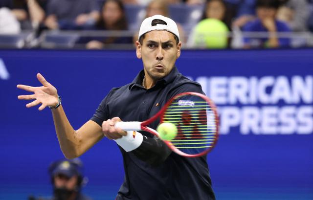 Chile's Alejandro Tabilo hits a return to Germany's Alexander Zverev during their men's singles third round tennis match on day seven of the US Open tennis tournament at the USTA Billie Jean King National Tennis Center in New York City on September 5, 2026. (Photo by Leonardo MUNOZ / AFP)