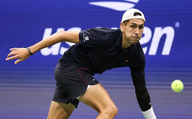 Chile's Alejandro Tabilo eyes the ball as he returns to Germany's Alexander Zverev during their men's singles third-round match on day seven of the US Open tennis tournament at the USTA Billie Jean King National Tennis Center in New York City on September 5, 2026.. (Photo by Leonardo MUNOZ / AFP)