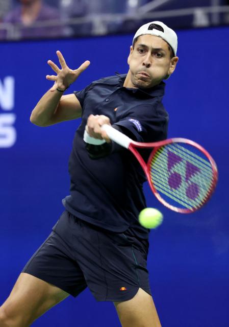 Chile's Alejandro Tabilo hits a return to Germany's Alexander Zverev during their men's singles third round tennis match on day seven of the US Open tennis tournament at the USTA Billie Jean King National Tennis Center in New York City in the early hours of September 6, 2026. (Photo by Leonardo MUNOZ / AFP)