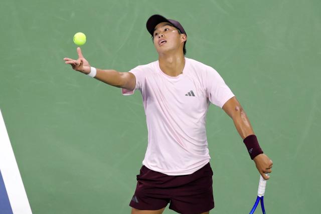 USA's Learner Tien serves to Czech Republic's Jakub Mensik during their men's singles third round tennis match on day seven of the US Open tennis tournament at the USTA Billie Jean King National Tennis Center in New York City on September 5, 2026. (Photo by KENA BETANCUR / AFP)