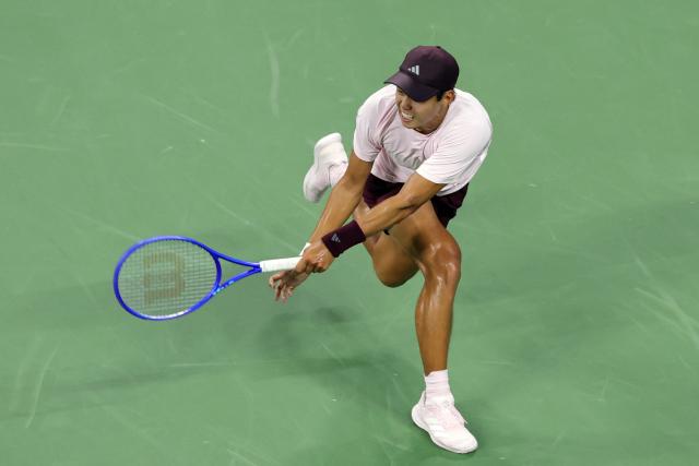 USA's Learner Tien hits a return to Czech Republic's Jakub Mensik during their men's singles third round tennis match on day seven of the US Open tennis tournament at the USTA Billie Jean King National Tennis Center in New York City on September 5, 2026. (Photo by KENA BETANCUR / AFP)