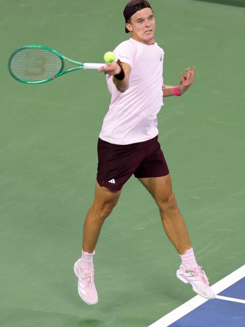 Czech Republic's Jakub Mensik hits a return to USA's Learner Tien during their men's singles third round tennis match on day seven of the US Open tennis tournament at the USTA Billie Jean King National Tennis Center in New York City on September 5, 2026. (Photo by KENA BETANCUR / AFP)