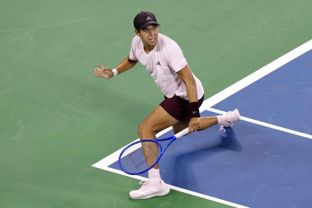 USA's Learner Tien hits a return to Czech Republic's Jakub Mensik during their men's singles third round tennis match on day seven of the US Open tennis tournament at the USTA Billie Jean King National Tennis Center in New York City in the early hours of September 6, 2026. (Photo by KENA BETANCUR / AFP)