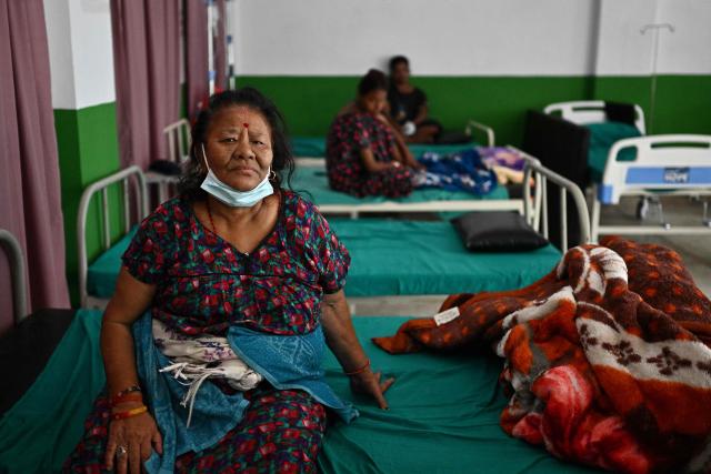 Flash flood survivors receive medical treatment inside a relief shelter at Devighat in Nepal's Nuwakot district on September 6, 2026. The tsunami-like wall of water, ice and debris unleashed by a massive glacial and rock collapse along the Nepal-China border killed at least 1,362 people and has left more than 5,500 missing across the two countries. (Photo by Pedro PARDO / AFP)