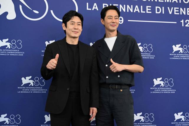 South Korean actors Sul Kyung-gu (L) and Zo In-Sung attend the photocall of "Possible Love" (Ga-Neung-han sa-rang) presented in competition at the 83rd International Venice Film Festival, at Venice Lido on September 6, 2026. (Photo by Tiziana FABI / AFP)