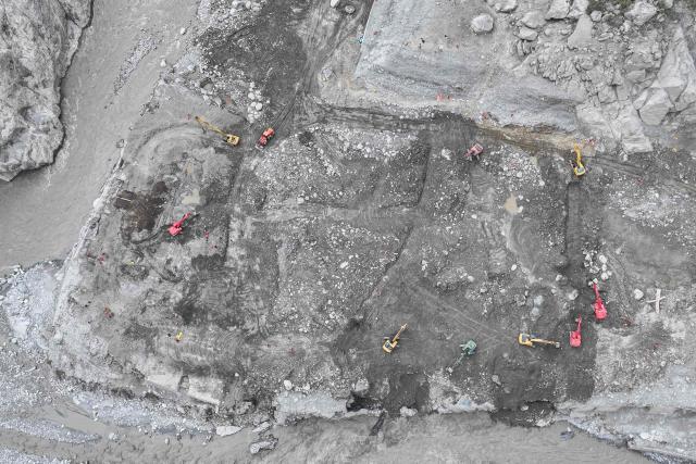 This aerial photo shows excavators working during recovery efforts at the site of the destroyed Gyirong Port border crossing in Gyirong County, in China’s western Tibet region on September 5, 2026. (Photo by CNS / AFP) / China OUT
