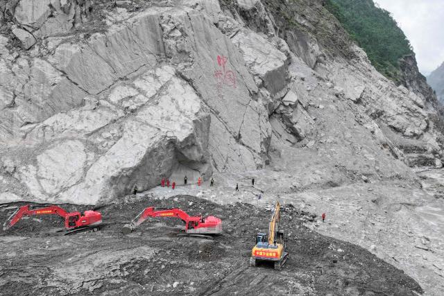 This aerial photo shows excavators working during recovery efforts at the site of the destroyed Gyirong Port border crossing in Gyirong County, in China’s western Tibet region on September 5, 2026. (Photo by CNS / AFP) / China OUT