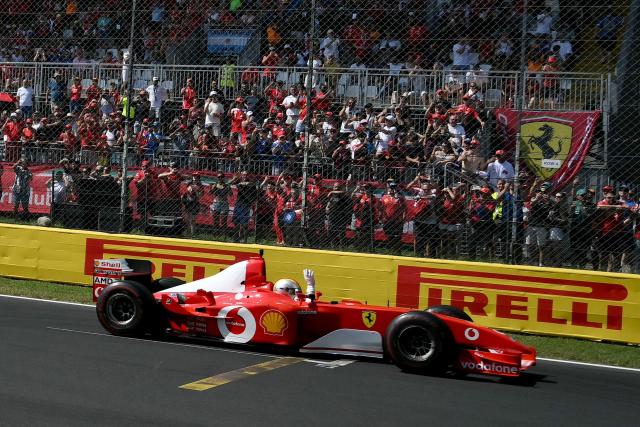 German former Ferrari driver and Formula One champion Sebastian Vettel drives Ferrari F2002 car of seven-time Formula One World Champion Michael Schumacher, as a special tribute by Scuderia Ferrari marking 30 years since he first joined the team, prior to the Italian Formula One Grand Prix at the Autodromo Nazionale Monza circuit in Monza, northern Italy on September 6, 2026. (Photo by Marco BERTORELLO / AFP)