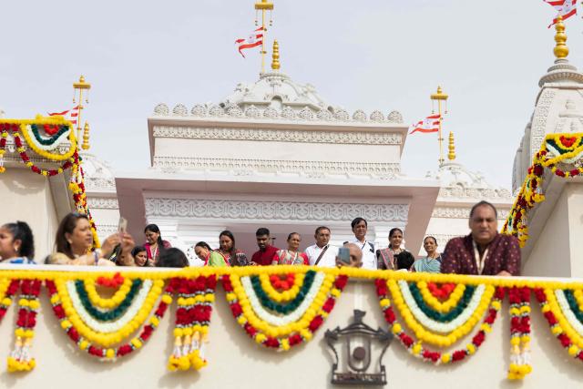 Hindu devotees gather inside the newly consecrated BAPS (Bochasanwasi Akshar Purushottam Swaminarayan Sanstha) Hindu temple in Bussy-Saint-Georges on September 6, 2026. On September 6, 2026, thousands of Hindus are celebrating the consecration of the first major temple built in France by the BAPS organization, which promotes it as 'an emblem of Indian culture and Hinduism.' Hailed as the largest Hindu temple built in continental Europe in a traditional style, the edifice stands in the new town of Bussy-Saint-Georges (Seine-et-Marne), 30 km east of the capital. (Photo by Kenzo TRIBOUILLARD / AFP)