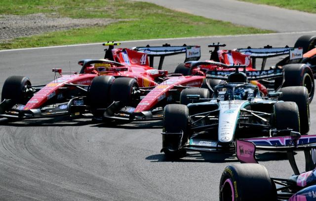 Ferrari's British driver Lewis Hamilton (L) and Ferrari's Monegasque driver Charles Leclerc (2nd L) compete during the Italian Formula One Grand Prix at the Autodromo Nazionale Monza circuit in Monza, northern Italy on September 6, 2026. (Photo by Andrej ISAKOVIC / AFP)