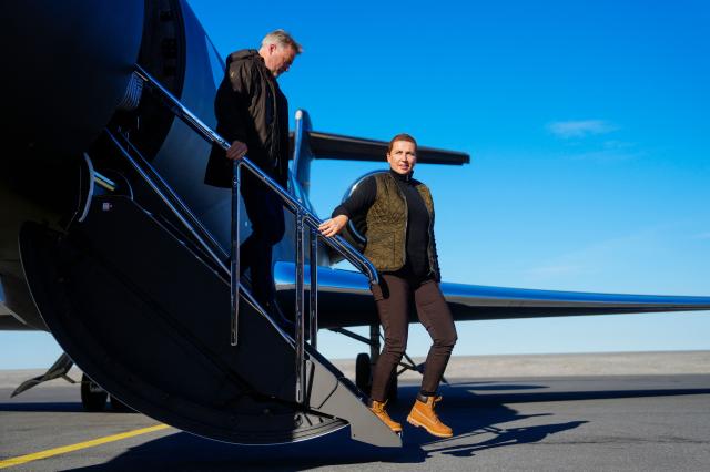 Denmark's Prime Minister Mette Frederiksen (R) and her husband Bo Tengberg arrive in Nuuk, on September 6, 2026. The Prime Minister visits Greenland together with the European Commission President and will, among other things, hold a meeting and go on a boat trip with Greenlandic government leader Jens-Frederik Nielsen. (Photo by Mads Claus Rasmussen / Ritzau Scanpix / AFP) / Denmark OUT
