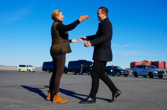 Denmark's Prime Minister Mette Frederiksen (L) is welcomed by Greenland's Prime Minister Jens-Frederik Nielsen upon arrival in Nuuk, on September 6, 2026. The Prime Minister visits Greenland together with the European Commission President and will, among other things, hold a meeting and go on a boat trip with Greenlandic government leader Jens-Frederik Nielsen. (Photo by Mads Claus Rasmussen / Ritzau Scanpix / AFP) / Denmark OUT