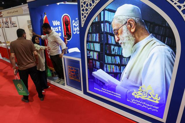 Iraqis visit the Iranian publishing pavilion at the Baghdad International Book Fair in Baghdad on September 6, 2026. (Photo by AHMAD AL-RUBAYE / AFP)