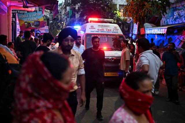 Ambulance vehicles line up as rescue personnel conduct a search operation for survivors at the site of a building collapse in the Satya Niketan area in New Delhi on September 6, 2026. (Photo by Sajjad HUSSAIN / AFP)