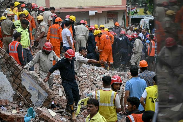 Rescue personnel conduct a search operation for survivors at the site of a building collapse in the Satya Niketan area in New Delhi on September 6, 2026. (Photo by Sajjad HUSSAIN / AFP)