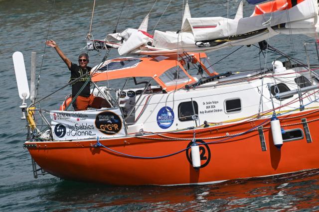 Turkish skipper Selim Yalcin leaves Les Sables-d'Olonne before the departure of the Golden Globe Race (GGR) , in Les Sables d’Olonne, western France, on September 6,  2026. The Golden Globe Race is a around the world solo sailing race without any electronic assistance . (Photo by Sebastien Salom-Gomis / AFP)