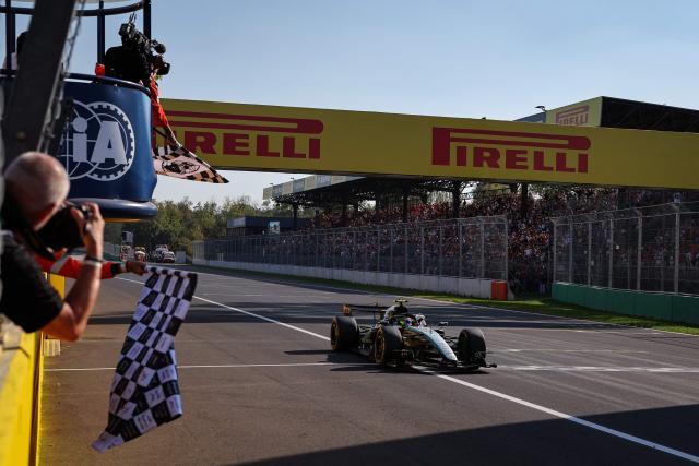 Mercedes' Italian driver Kimi Antonelli drives past the chequered flag to win the Italian Formula One Grand Prix at the Autodromo Nazionale Monza circuit in Monza, northern Italy on September 6, 2026. (Photo by ANNA SZILAGYI / POOL / AFP)