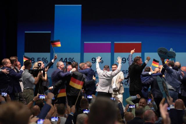 Members and supporters of the far-right Alternative for Germany (AfD) party react after the first exit poll results were announced on public television at the AfD's election party following Saxony-Anhalt's state elections in Magdeburg, eastern Germany on September 6, 2026. Germany's far-right AfD won key regional elections on September 6 by a landslide with at least 44 percent of the vote in the eastern state of Saxony-Anhalt, said exit polls by two public broadcasters. (Photo by Ronny HARTMANN / AFP)