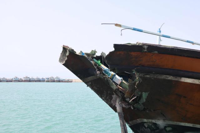 The bow of a vessel moored at the port of Kuhestak, is damaged following a US military strike earlier in the week on Kuhestak, Sirik County, in Iran's southern Hormozgan province on September 6, 2026. Iran's top negotiator threatened on September 6, 2026 a more forceful response to any further US attacks after Tehran targeted American warships in their latest round of clashes. The exchanges of fire, which began with US raids last week, come amid a deadlock in the six-month war between the two foes. Iran has maintained its stranglehold on the strategic Strait of Hormuz while Washington continues a counter-blockade of Iranian ports. (Photo by ATTA KENARE / AFP) / 