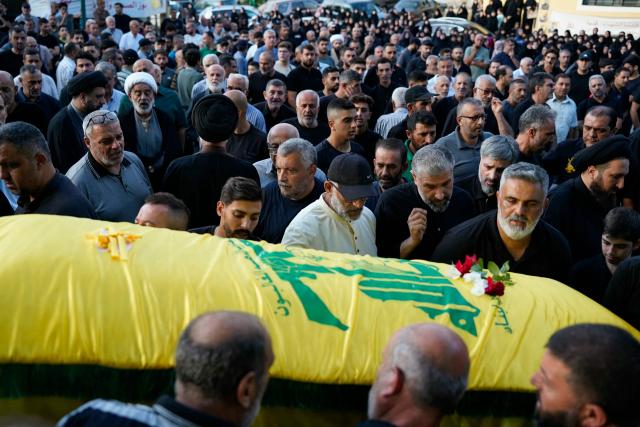 Mourners carry the casket of Israa Bahjat, one of two women killed earlier in an Israeli strike on the village of Arabsalim, during her funeral in the southern Lebanese village of Jibshit on September 6, 2026. Lebanon’s Health Ministry said on September 6 that four people were killed in Israeli strikes in the south of the country, while Israel said it had carried out raids following a Hezbollah drone attack targeting its soldiers. (Photo by Ammar Ammar / AFP) / 