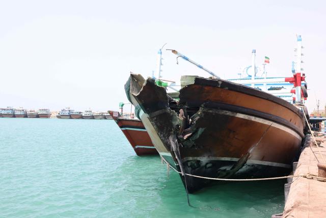 The bow of a vessel moored at the port of Kuhestak, is damaged following a US military strike earlier in the week on Kuhestak, Sirik County, in Iran's southern Hormozgan province on September 6, 2026. Iran said it hit US military bases in Kuwait and the UAE on September 3, 2026, vowing to avenge a wedding attack it blamed on Washington as the US Vice President said the strike was being investigated. The new clashes, which began with US raids on September 6, 2026, deepened the impasse in the six-month war, as Iran maintains a stranglehold on the strategic Strait of Hormuz and Washington presses its counter-blockade of Iranian ports. (Photo by ATTA KENARE / AFP) / 