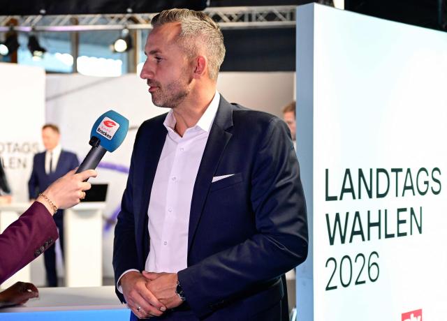 Ulrich Siegmund, top candidate in the Saxony-Anhalt state election for the far-right Alternative for Germany (AfD) is interviewed after exit poll results were announced on public broadcaster ZDF at the fair grounds during Saxony-Anhalt's state elections in Magdeburg, eastern Germany on September 6, 2026. Germany's far-right AfD won key regional elections September 6, 2026 by a landslide with at least 44 percent of the vote in the eastern state of Saxony-Anhalt, said exit polls by two public broadcasters. (Photo by John MACDOUGALL / AFP)