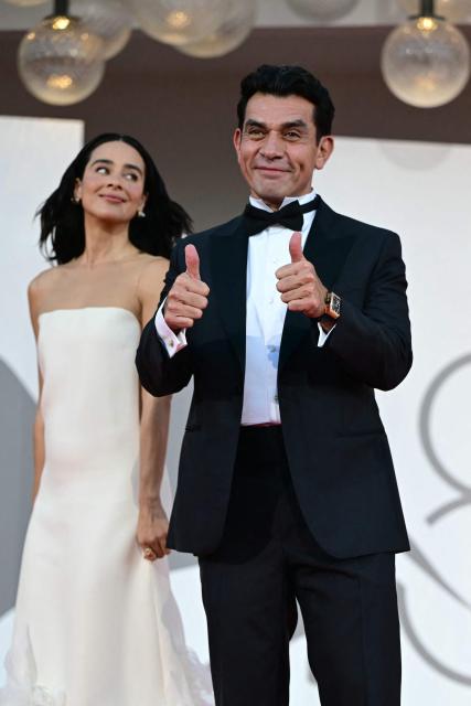 Actress Esmeralda Pimentel, and actor Jorge Salinas, cast members of the movie “Hombre Al Agua”, attend the red carpet event before the screening of "The Echo chamber" presented in competition at the 83rd International Venice Film Festival, at Venice Lido on September 6, 2026. (Photo by Stefano Rellandini / AFP)