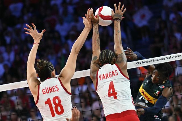 Turkey's opposite #04 Melissa Teresa Vargas (C) blocks the ball from Italy's outside hitter #17 Myriam Fatime Sylla (R) during the Women's European Volleyball Championship EuroVolley final match between Italy and Turkey at the Sinan Erdem Sports Hall in Istanbul on September 6, 2026. (Photo by Ozan KOSE / AFP)