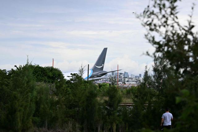 The tail section of a cargo plane is seen at Miami International Airport after it overran the runway at Miami International Airport in Miami, Florida, on September 6, 2026. (Photo by CHANDAN KHANNA / AFP)