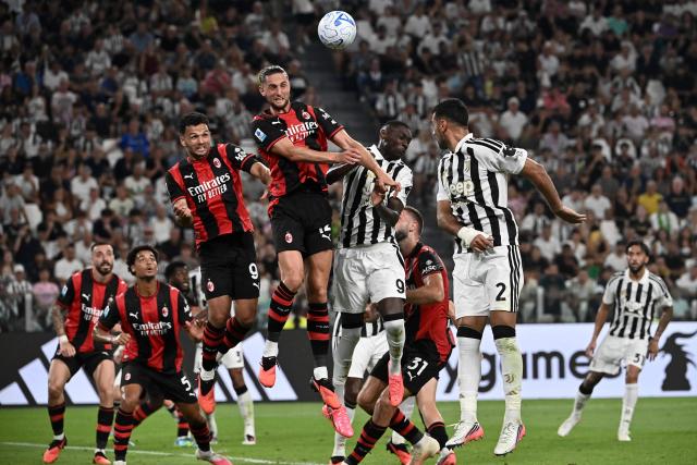 AC Milan's Portuguese forward #09 Goncalo Ramos and AC Milan's French midfielder #12 Adrien Rabiot, Juventus' French forward #09 Randal Muani Kolo and Juventus' Turkish defender #02 Mehmet Zeki Celik jump for a header during the Italian Serie A football match between Juventus and AC Milan at the Allianz Stadium in Turin on September 6, 2026. (Photo by Isabella BONOTTO / AFP)