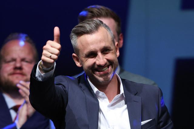 Ulrich Siegmund, far-right Alternative for Germany (AfD)'s main candidate in the Saxony-Anhalt state election, gives the thumbs up as he addresses supporters at the AfD's election party following Saxony-Anhalt's state elections in Magdeburg, eastern Germany on September 6, 2026. Germany's far-right AfD won a landslide victory in a key regional election on September 6 in the ex-communist east, according to exit polls, but it remain unclear whether it can win an absolute majority to govern. (Photo by Ronny HARTMANN / AFP)