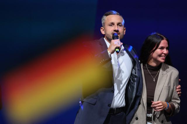 Ulrich Siegmund (L), far-right Alternative for Germany (AfD)'s main candidate in the Saxony-Anhalt state election, addresses supporters next to his wife Julia Siegmund at the AfD's election party following Saxony-Anhalt's state elections in Magdeburg, eastern Germany on September 6, 2026. Germany's far-right AfD won a landslide victory in a key regional election on September 6 in the ex-communist east, according to exit polls, but it remain unclear whether it can win an absolute majority to govern. (Photo by Ronny HARTMANN / AFP)