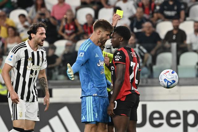 Juventus' Italian goalkeeper Guglielmo Vicario faces AC Milan's Italian midfielder #70 Alphadjo Cisse who received a yellow card during the Italian Serie A football match between Juventus and AC Milan at the Allianz Stadium in Turin on September 6, 2026. (Photo by Isabella BONOTTO / AFP)