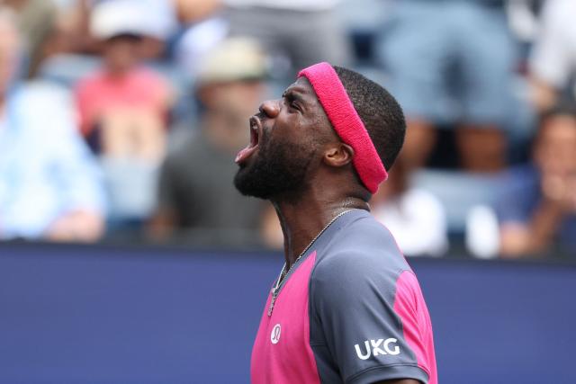 USA's Frances Tiafoe reacts as he plays Russia's Daniil Medvedev in their men's singles round of 16 tennis match on day eight of the US Open tennis tournament at the USTA Billie Jean King National Tennis Center in New York on September 6, 2026. (Photo by Leonardo MUNOZ / AFP)