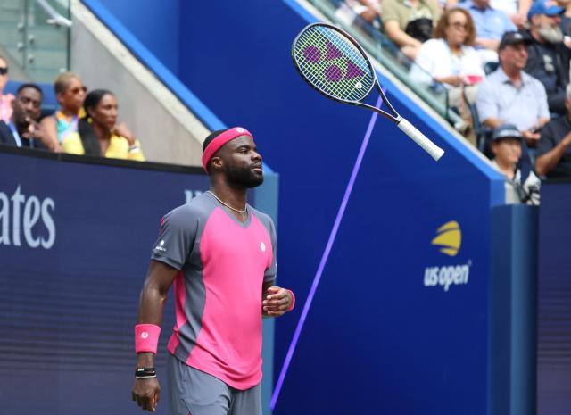 USA's Frances Tiafoe tosses his racquet as he plays Russia's Daniil Medvedev in their men's singles round of 16 tennis match on day eight of the US Open tennis tournament at the USTA Billie Jean King National Tennis Center in New York on September 6, 2026. (Photo by Leonardo MUNOZ / AFP)