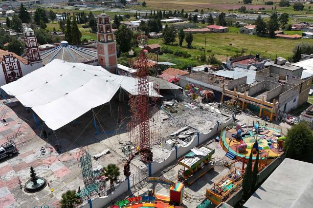 This aerial view shows the site of a fireworks blast in Santa Maria Canchesda, Mexico state, Mexico on September 6, 2026. A fireworks explosion at a church while hundreds of people were celebrating a patron saint's festival in Mexico killed at least 10 people and left more than 60 injured, authorities reported September 6, 2026. (Photo by Ramses MERCADO / AFP)