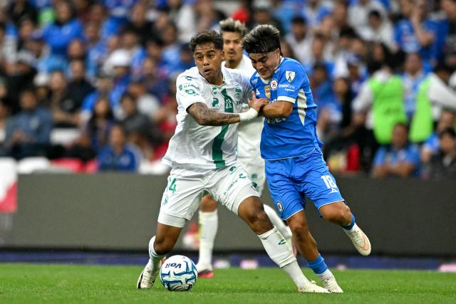 Santos' Mexican defender #14 Efrain Orona and Cruz Azul's forward #18 Luka Romero fight for the ball during the Liga MX Apertura tournament football match between Cruz Azul and Santos, at the Cuauhtemoc stadium in Puebla, Mexico on September 6, 2026. (Photo by CARL DE SOUZA / AFP)