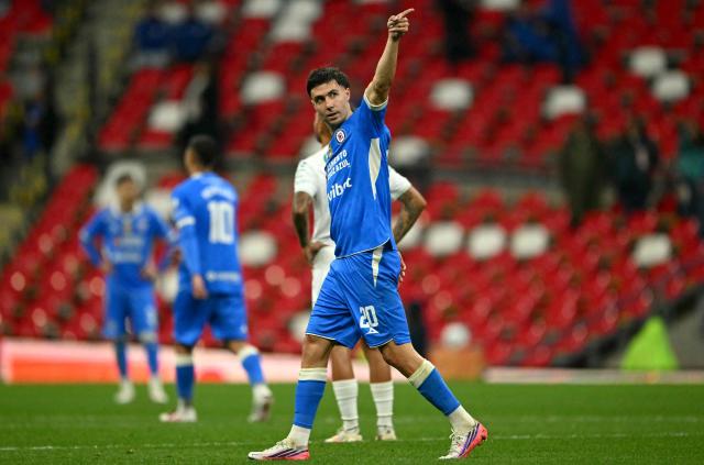 Cruz Azul's Argentine forward #20 Jose Paradela celebrates scoring his team's first goal during the Liga MX Apertura tournament football match between Cruz Azul and Santos, at the Cuauhtemoc stadium in Puebla, Mexico on September 6, 2026. (Photo by CARL DE SOUZA / AFP)