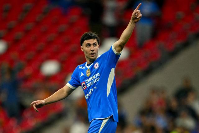 Cruz Azul's Argentine forward #20 Jose Paradela celebrates scoring his team's first goal during the Liga MX Apertura tournament football match between Cruz Azul and Santos, at the Cuauhtemoc stadium in Puebla, Mexico on September 6, 2026. (Photo by CARL DE SOUZA / AFP)